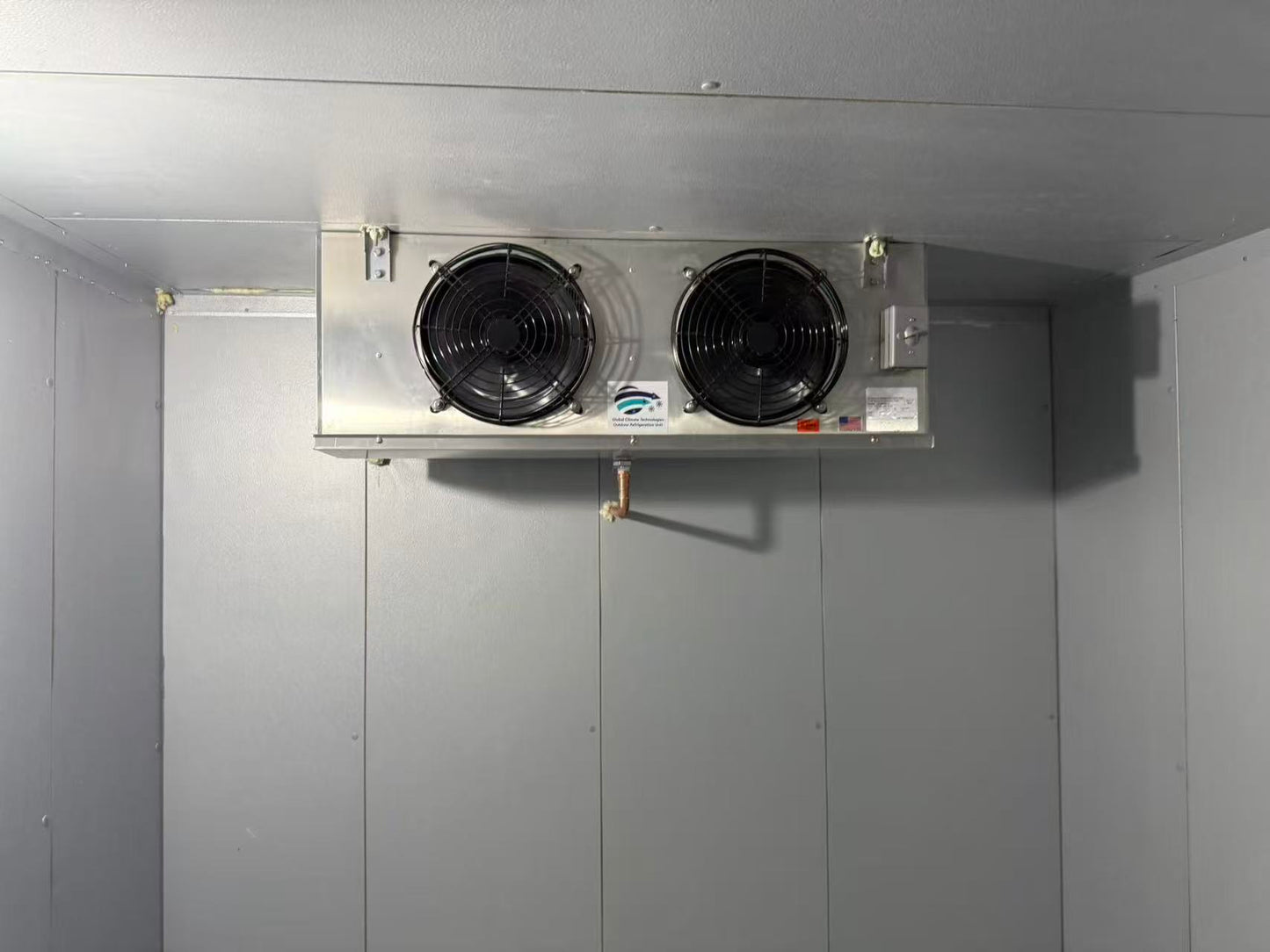 Walk-in cooler interior with dual-fan evaporator unit installed