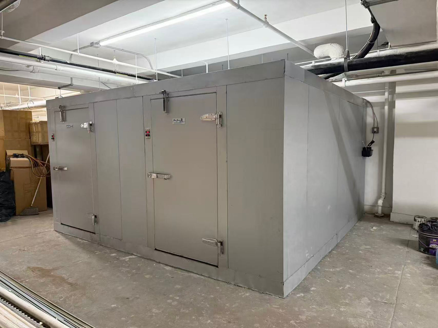 Snow Village walk-in cooler freezer combo installed on site in a New York restaurant basement